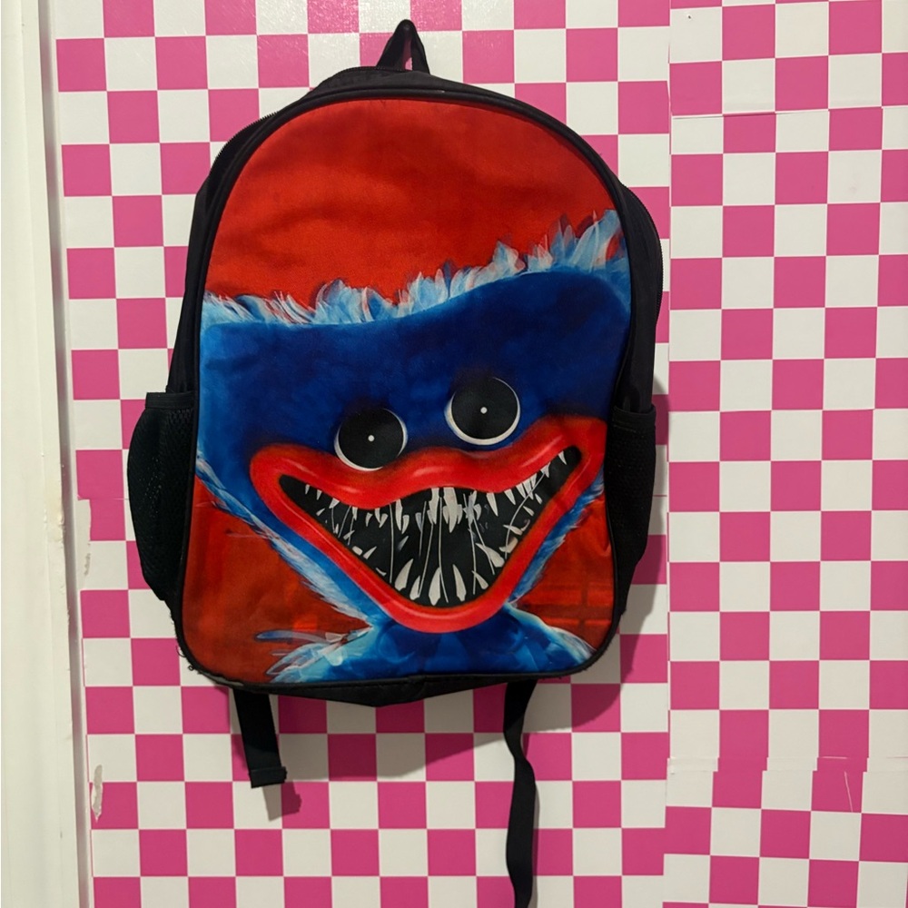 Source Unknown Red and Blue Monster Backpack